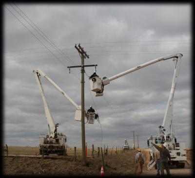 Several linemen crews work to repair 3-phase after storm damage.